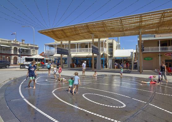 a group of kids playing in a water park