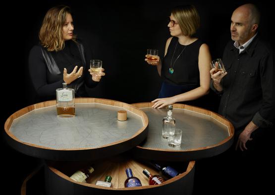 a group of people holding glasses of alcohol