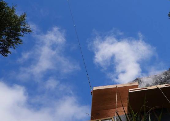 a helicopter flying over a building