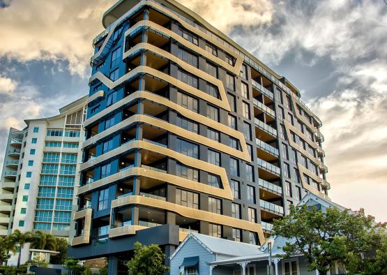 a tall building with many balconies