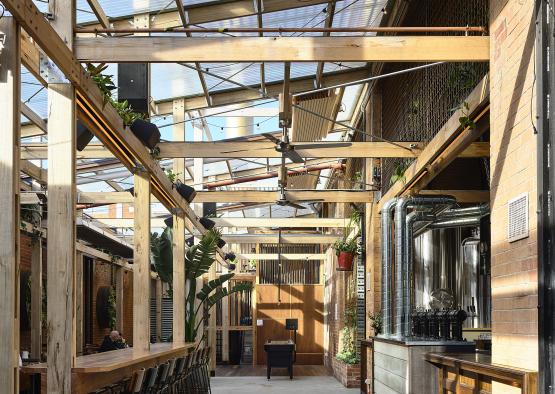 a room with a glass roof and a bar