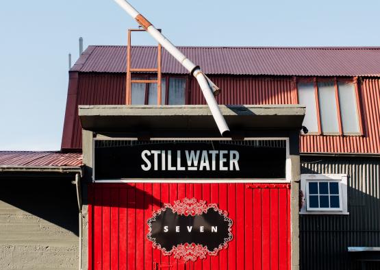 a red door with a white pole on top