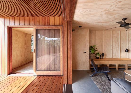 a room with a glass door and a table