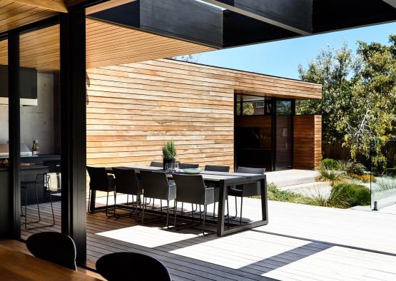 a table and chairs on a deck