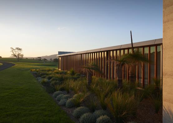 a building with a garden and grass