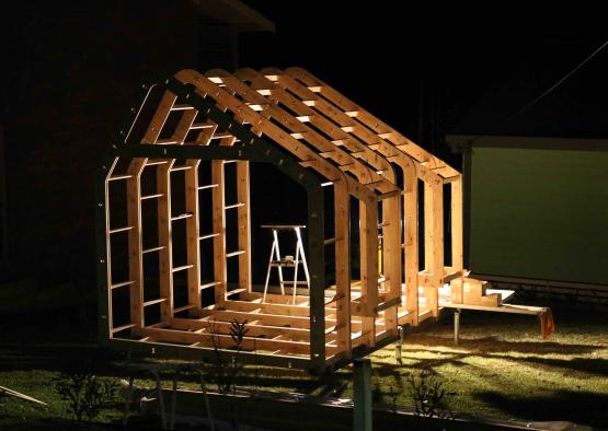 a building a house at night