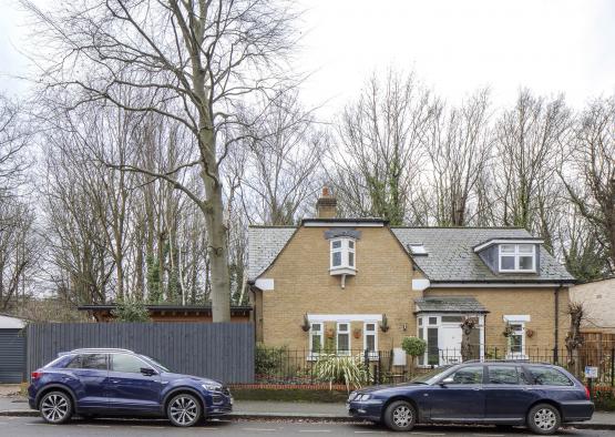 cars parked cars in front of a house