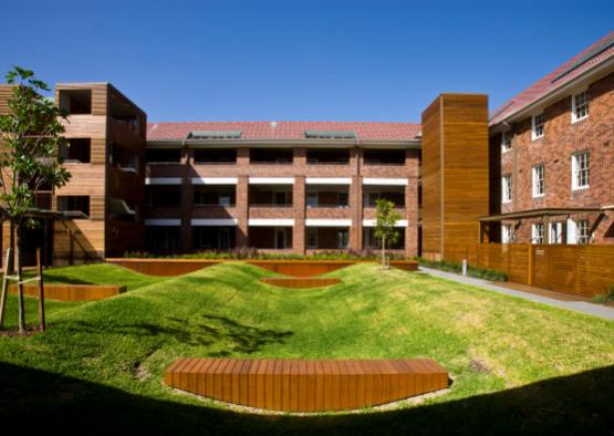 a building with a lawn and a park