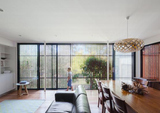 a child walking in a living room