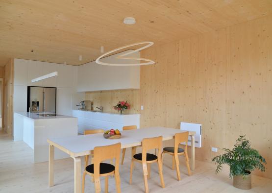 a dining table and chairs in a room