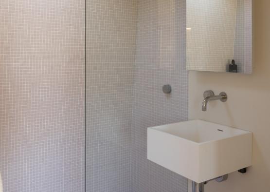 a bathroom with a sink and mirror