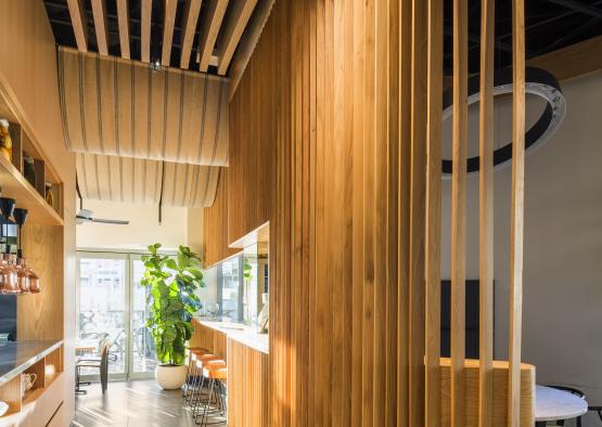 a room with wood walls and a table and chairs