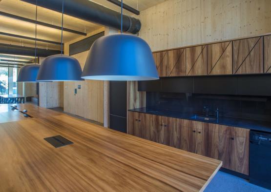 a table with blue lamps from ceiling