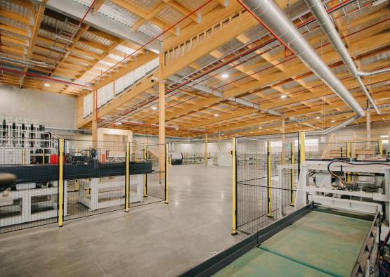 a large room with a large metal fence and a large metal pipe