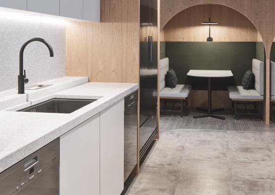 a kitchen with white cabinets and a black sink