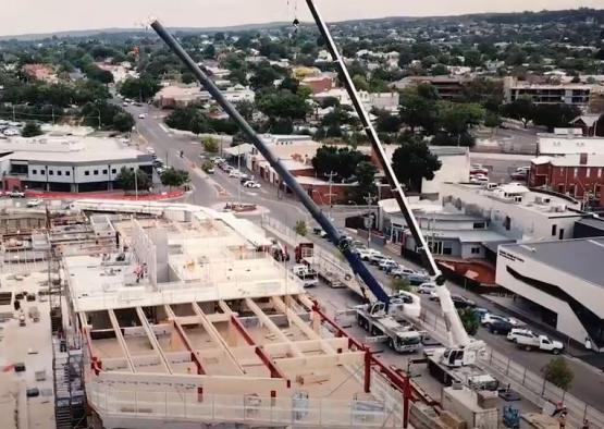 a crane lifting a building