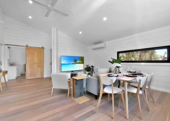 a living room with a television and a table