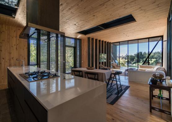 a kitchen and living room with a large window