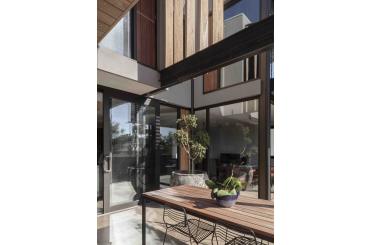 a table and chairs outside of a house