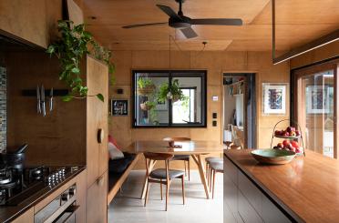 a kitchen with a table and chairs