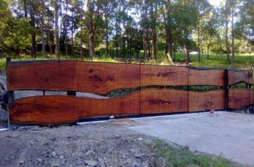 a wood fence with trees in the background