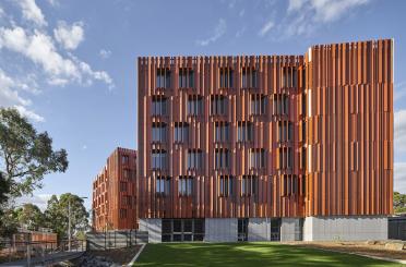 a building with a fence and grass