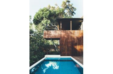 a pool in front of a house