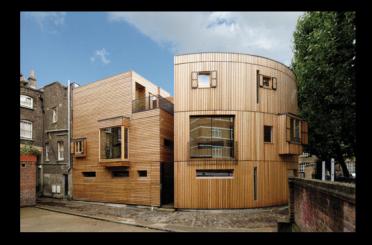 a wooden building with a round roof