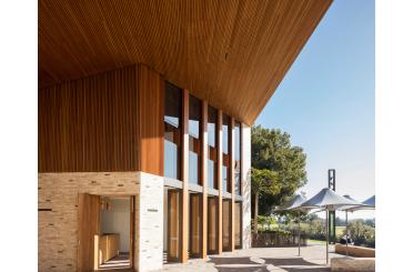 a building with a wood paneled roof